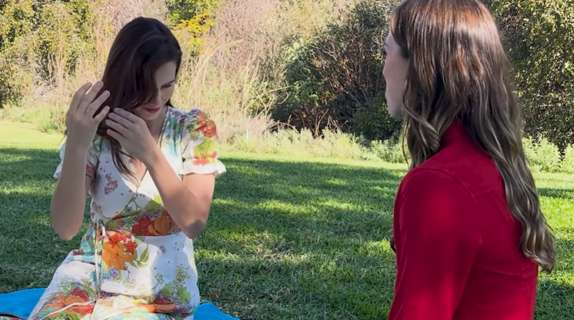 Moriah Boone shows Olivia Lyall how she once hid behind her hair to avoid attention, as posted on January 12, 2025 | Source: YouTube/CoffeeConversations24