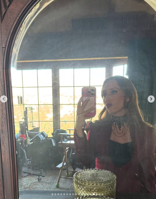 Rebecca Berg as Beta Beth on set, capturing a behind-the-scenes mirror selfie in full costume, as posted on March 16, 2025 | Source: Instagram/beccabjerg